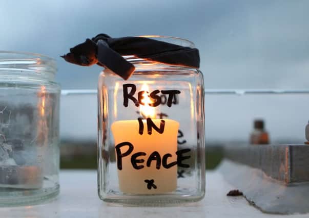 One of the tributes left in memory of the airshow tragedy's victims last year