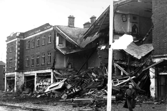 A gaping hole in Highbury Buildings, Cosham, where a bomb wrecked shops and flats.
