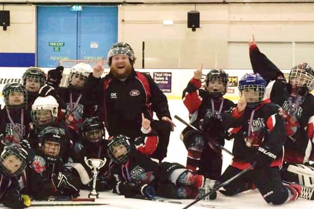 The jubilant Solent & Gosport Devils Dragons team celebrates victory in the Swindon Hockey Academy under-nine tournament