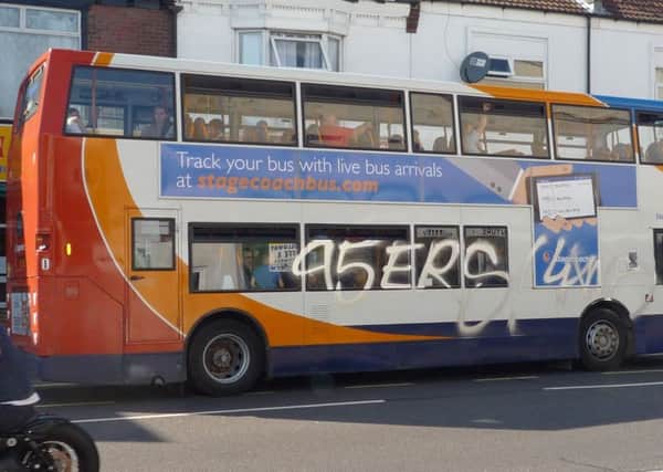 A vandal spray-painted a bus in London Road on August 17. Picture: Ian Cope