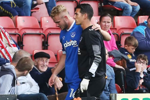 Jack Whatmough is helped off the pitch during last weekend's game at Crewe Picture: Joe Pepler