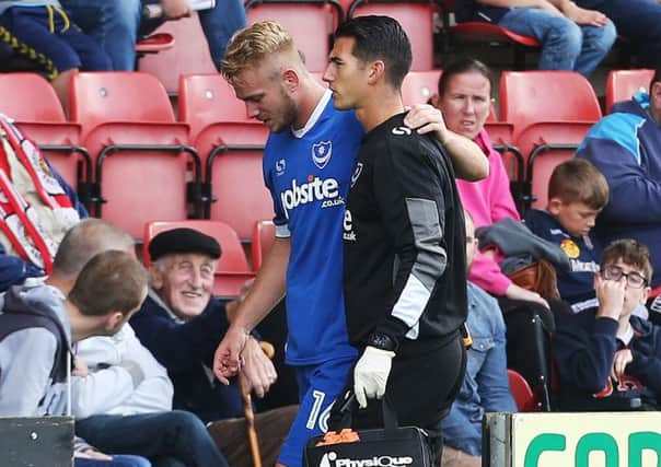 Jack Whatmough is helped off the pitch during last weekend's game at Crewe Picture: Joe Pepler