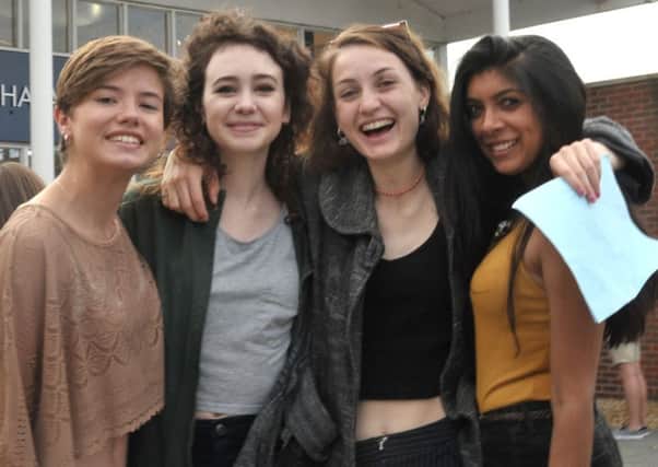 From left, 
Georgina Pine, 19, Ele Marchant, 19, Ella Davidson, 18, and Radhika Parekh, 18 celebrate after getting their results at Havant Sixth Form College 
Picture: Mick Young (161079-06)