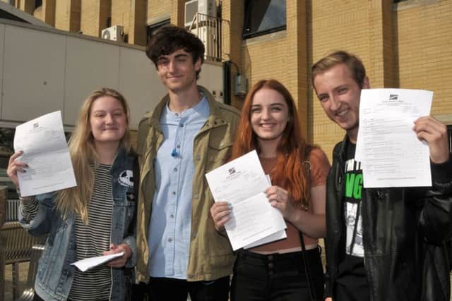 Classics students Sian Damarell, 18, Matt Douglas, 18, Maura Lindsay, 18, and Ryan Harris, 18, get their results 
Picture: Mick Young (161080-02)