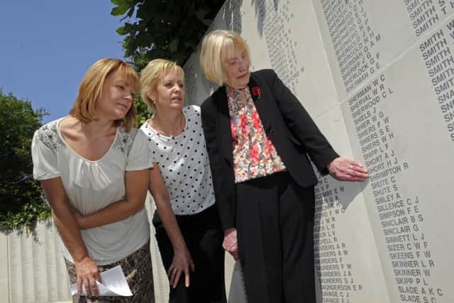 Jean Louth and her daughters (left), Janette Ellis-Brown and Jackie Frith at the memorial to Jean's father, Harry Short 
Picture: Ian Hargreaves (141793-4)