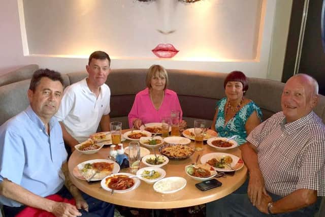 Richard Moss, Robert Capel, Anne Moss, Pat Blackburn, Kaz Miah, and Peter Blackburn enjoying a curry in Pasha, Cowplain on one of the Blackburns' trips back to the UK