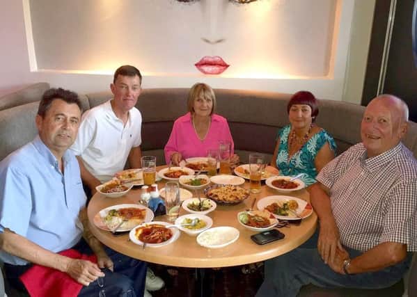 Richard Moss, Robert Capel, Anne Moss, Pat Blackburn, Kaz Miah, and Peter Blackburn enjoying a curry in Pasha, Cowplain on one of the Blackburns' trips back to the UK