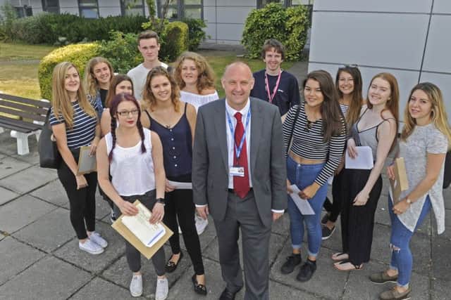 St Vincent College principal Matt Atkinson and students who got their A-level results this week Picture Ian Hargreaves (161108-3)