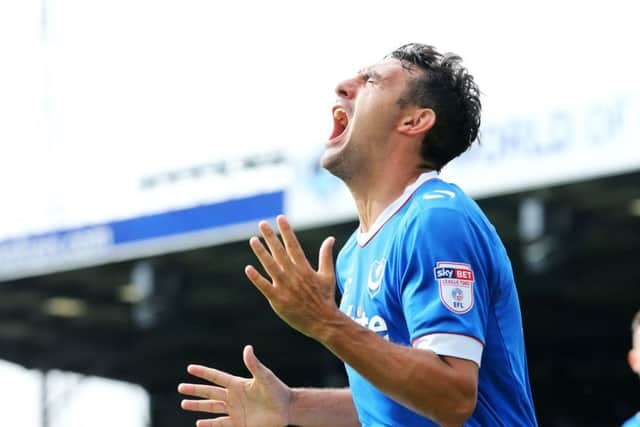 Gary Roberts celebrates his first goal in Pompey's 2-0 success against Colchester Picture: Joe Pepler