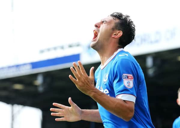 Gary Roberts celebrates his first goal in Pompey's 2-0 success against Colchester Picture: Joe Pepler
