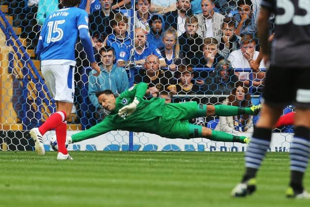 Davide Forde makes a crucial late save during today's win against Colchester Picture: Joe Pepler