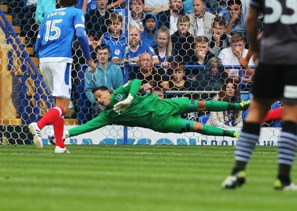 Davide Forde makes a crucial late save during today's win against Colchester Picture: Joe Pepler