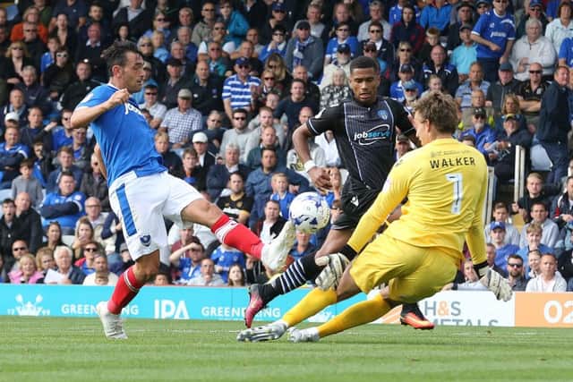 Gary Roberts scores Pompey's second goal in their 2-0 victory against Colchester Picture: Joe Pepler