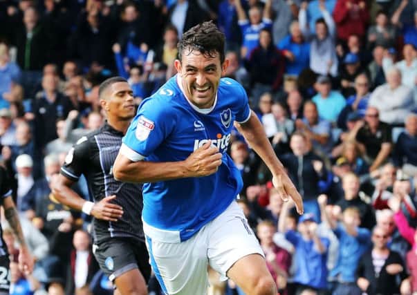 Gary Roberts celebrates scoring his and Pompey's first goal from the penalty spot in the Blues' 2-0 win over Colchester on Saturday   Picture: Joe Pepler