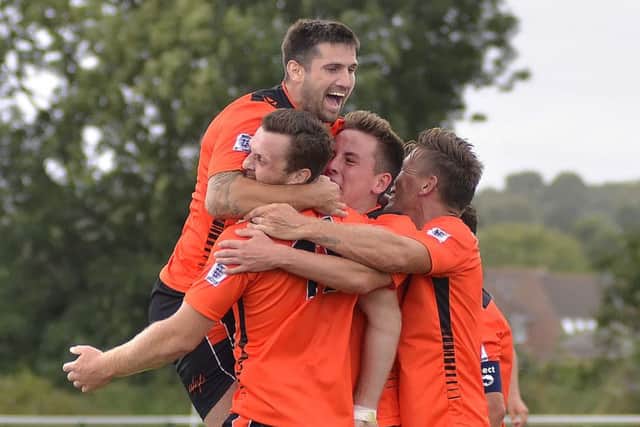 Joe Noakes is mobbed by his Portchester team-mates. Picture: Joe Pepler