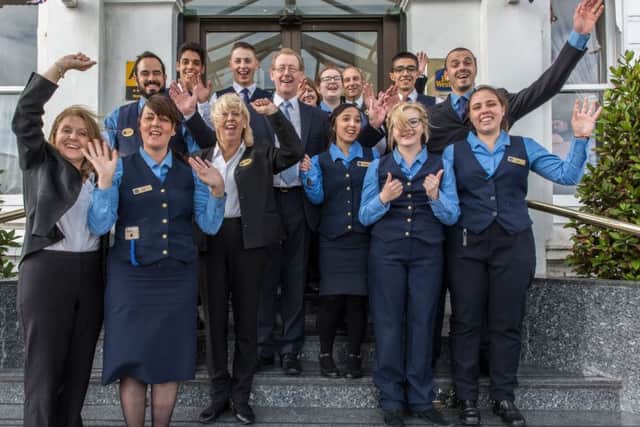 Celebratory cheers from the Royal Beach Hotel staff
