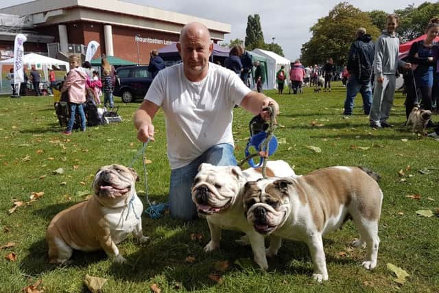 Terry Picton, 46, from Hilsea, with Roxy, Ronnie and Peggy the bulldogs Pictures: Kimberley Barber
