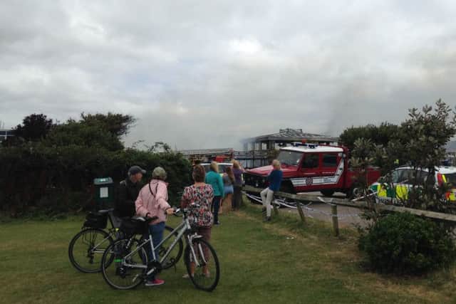 Residents watch in disbelief as emergency services tackle the fire. Picture by Stephen Wynn-Davies SUS-160821-164035001