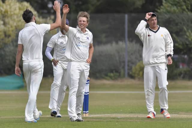 Fraser Hay celebrates one of his four wickets but Portsmouth were outgunned by Sarisbury. Picture: Neil Marshall