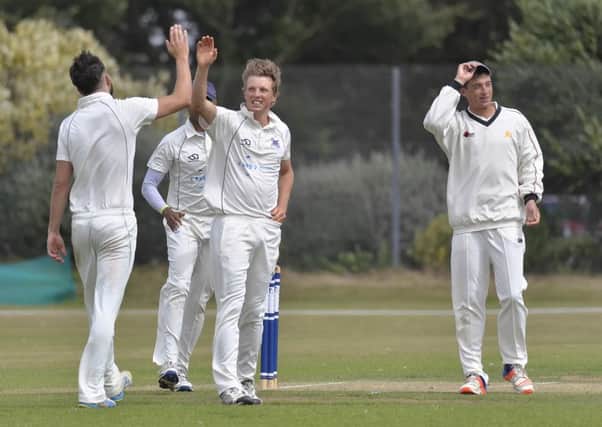 Fraser Hay celebrates one of his four wickets but Portsmouth were outgunned by Sarisbury. Picture: Neil Marshall