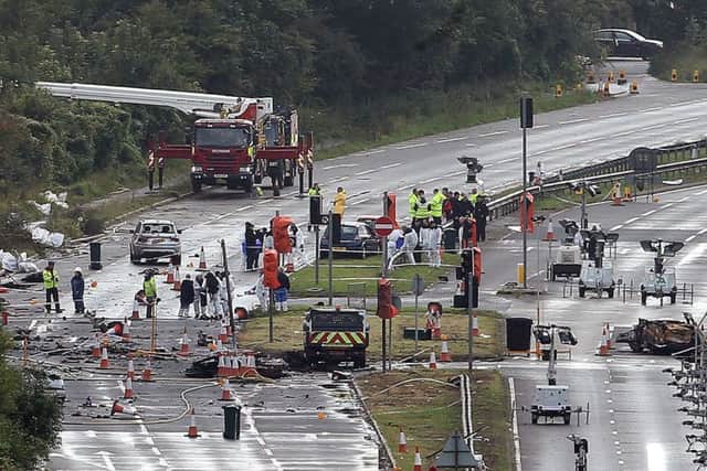 File photo dated 26/08/15 of emergency services working on the A27 at Shoreham in West Sussex following the Shoreham air disaster.
Picture: Steve Parsons/PA Wire