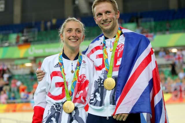 Great Britain's Jason Kenny after winning the gold medal in the Men's Keirin Final poses with fiancee Laura Trott who won gold in the Women's Omnium. Warren and his daughterrs held their own Olympics PRESS ASSOCIATION Photo