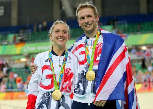 Great Britain's Jason Kenny after winning the gold medal in the Men's Keirin Final poses with fiancee Laura Trott who won gold in the Women's Omnium. Warren and his daughterrs held their own Olympics PRESS ASSOCIATION Photo