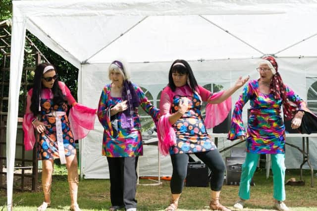 Dorothy Tucker and Betty Figgins perform as Abba with care home workers Emily Rose and Karen Moore