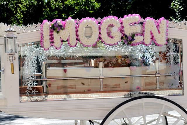 The coffin of Imogen Mead with a floral tribute on its horse-drawn carriage.   Picture: Sarah Standing (161129-1437)