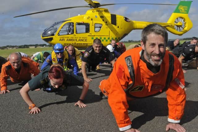 Andy Ellwood leads the emergency services team in the push-up challenge Picture: Ian Hargreaves