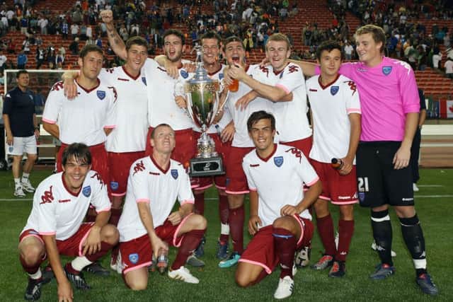 Liam O'Brien, right, and the Edmonton Cup winners. Picture: Joe Pepler