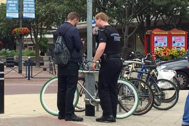 Police in Palmerston Road last month after Brendan Hughes bike was stolen and then found chained up the next day.