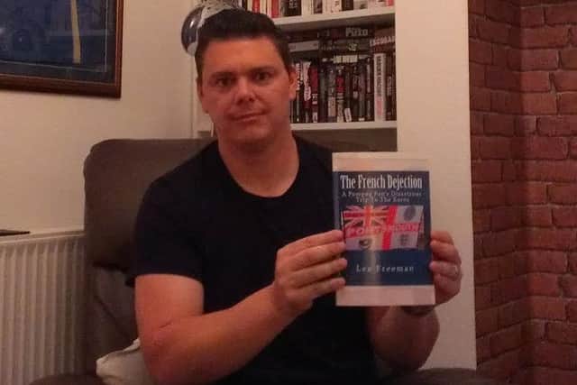 Lee Freeman with his book The French Dejection