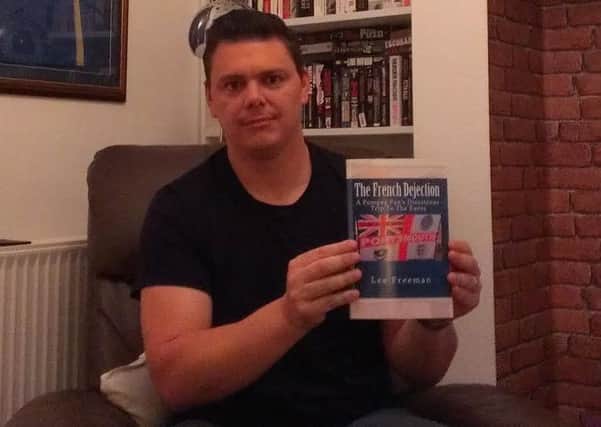 Lee Freeman with his book The French Dejection