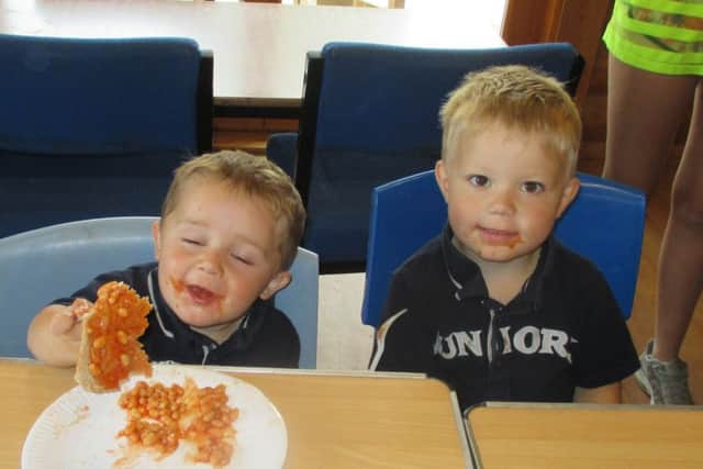 Elliott Pack and Simon Pointing enjoying free food as part of a Food Portsmouth scheme