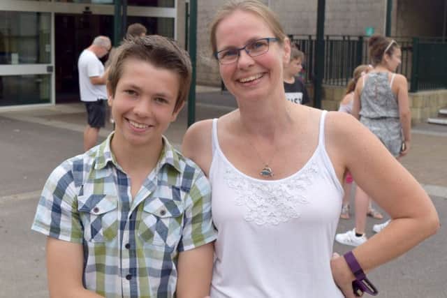 Matt Saunders, 15, who took his GCSEs a year early and his mother, Karen Saunders at Henry Cort Community College.Picture: Loughlan Campbell