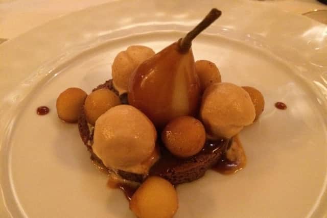 Pears poached in red wine served with Champagne sorbet