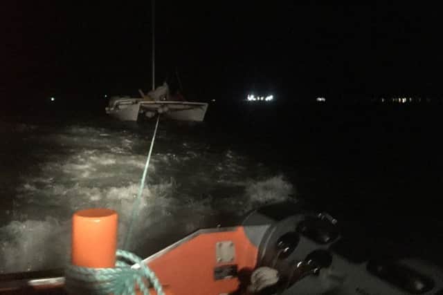 Gosport lifeboat tows 31ft catamaran to safetyGosport independent lifeboat was called to assist a stricken 31ft catamaran in The Solent on Thursday evening.UK Coastguard requested Gosport & Fareham Inshore Rescue Services lifeboat, the Joan Dora Fuller, take over a tow of a casualty vessel from Bembridge Lifeboat after it had got into difficulties off Ventor, Isle of Wight, at around 1930.GAFIRS rendezvoused with the RNLI launch at 2200 at No Mans Land Fort and took over the tow of the catamaran, which had only the skipper on board.The craft had left Dartmouth earlier that day and got into difficulties when its engine failed and a lack of wind left it dead in the water. GAFIRS coxswain Brian Pack said: We placed a crewman on board the casualty vessel and rigged a tow line. The catamaran was tricky to tow, though, as it had a problem with its steerage.It took around an hour to tow the vessel to Gosport Marina where she was safely brought alongside with the help of Hillhead Coastguard Rescue Team.The