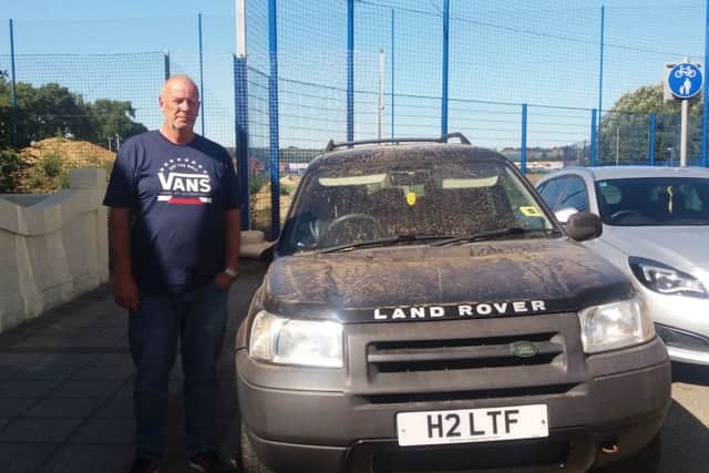 Trevor Edney in Devon Road, in Copnor, with his car covered in dust after work at Pompey's training ground