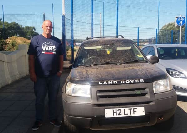 Trevor Edney in Devon Road, in Copnor, with his car covered in dust after work at Pompey's training ground