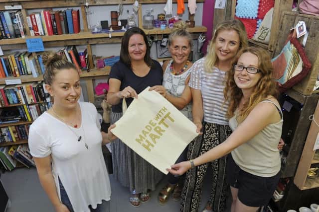 From left, manager Jenna Boyson with volunteer staff members Zoe Knight, Rachel McLeod and daughter Olivia McLeod and Ruby Sink at the Made with Harrt charity shop in Elm Grove Picture: Ian Hargreaves (161202-1)