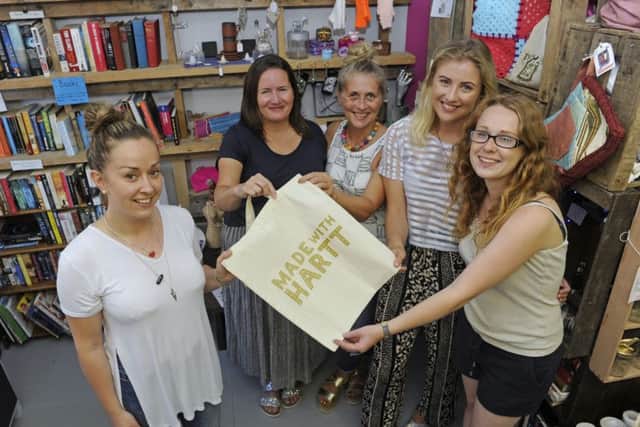 From left, manager Jenna Boyson with volunteer staff members Zoe Knight, Rachel McLeod and daughter Olivia McLeod and Ruby Sink at the Made with Harrt charity shop in Elm Grove 
Picture: Ian Hargreaves (161202-1)
