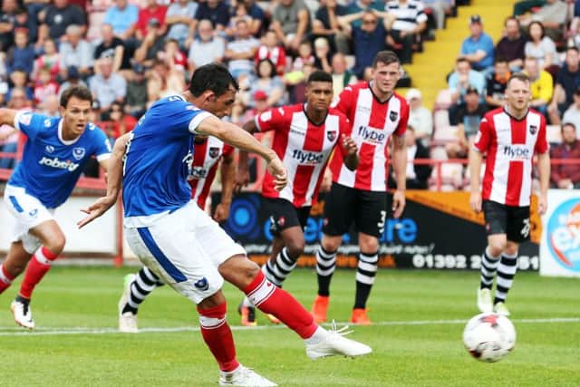 Gary Roberts scores his penalty. Picture: Joe Pepler