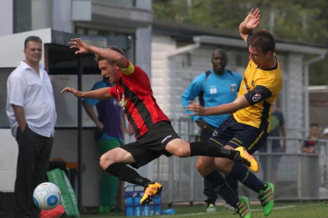 Josh Carmichael tackles a Bishop's Stortford rival as Alex Pike looks on. Picture: Habibur Rahman