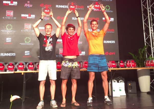 Rob Arkell, left, on the podium in Budapest