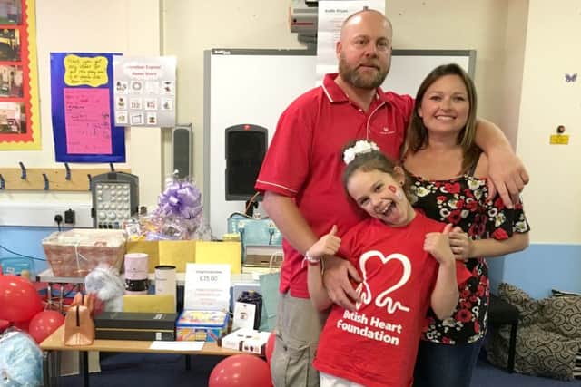 Andy and Fay Butler, with their daughter Grace
