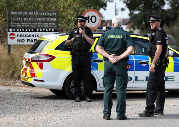 Police at the scene on Harbour Road, Pagham, West Sussex, where they are in a stand-off with a 72-year-old man who is thought to have a gun. 
Picture : Andrew Matthews/PA Wire