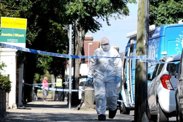 The scene in Outram Road, Southsea, where a man's body was found sparking a murder probe Picture: Sarah Standing (161247-2262)