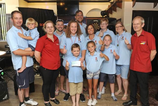 The Fareham Pub landlord and landlady Martin and Diane Munns with friends and family of Charlie Harris, front
Picture: Ian Hargreaves (161208-1)