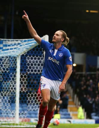 Adam McGurk sported a man-bun in his one-season Pompey stay Picture: Joe Pepler